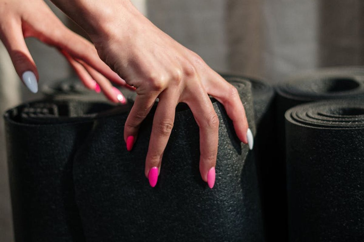 Close-up of a textured yoga mat in a sunlit room