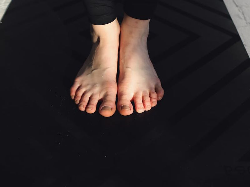 Detailed close-up of a yoga practitioner's hands and alignment