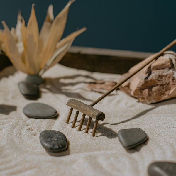 Small zen garden with stones representing balance and peace